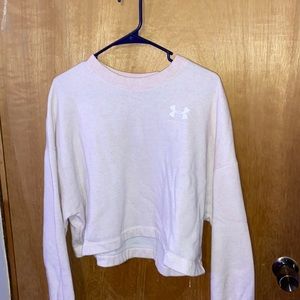 Women’s pink/white Under Armour cropped crewneck.